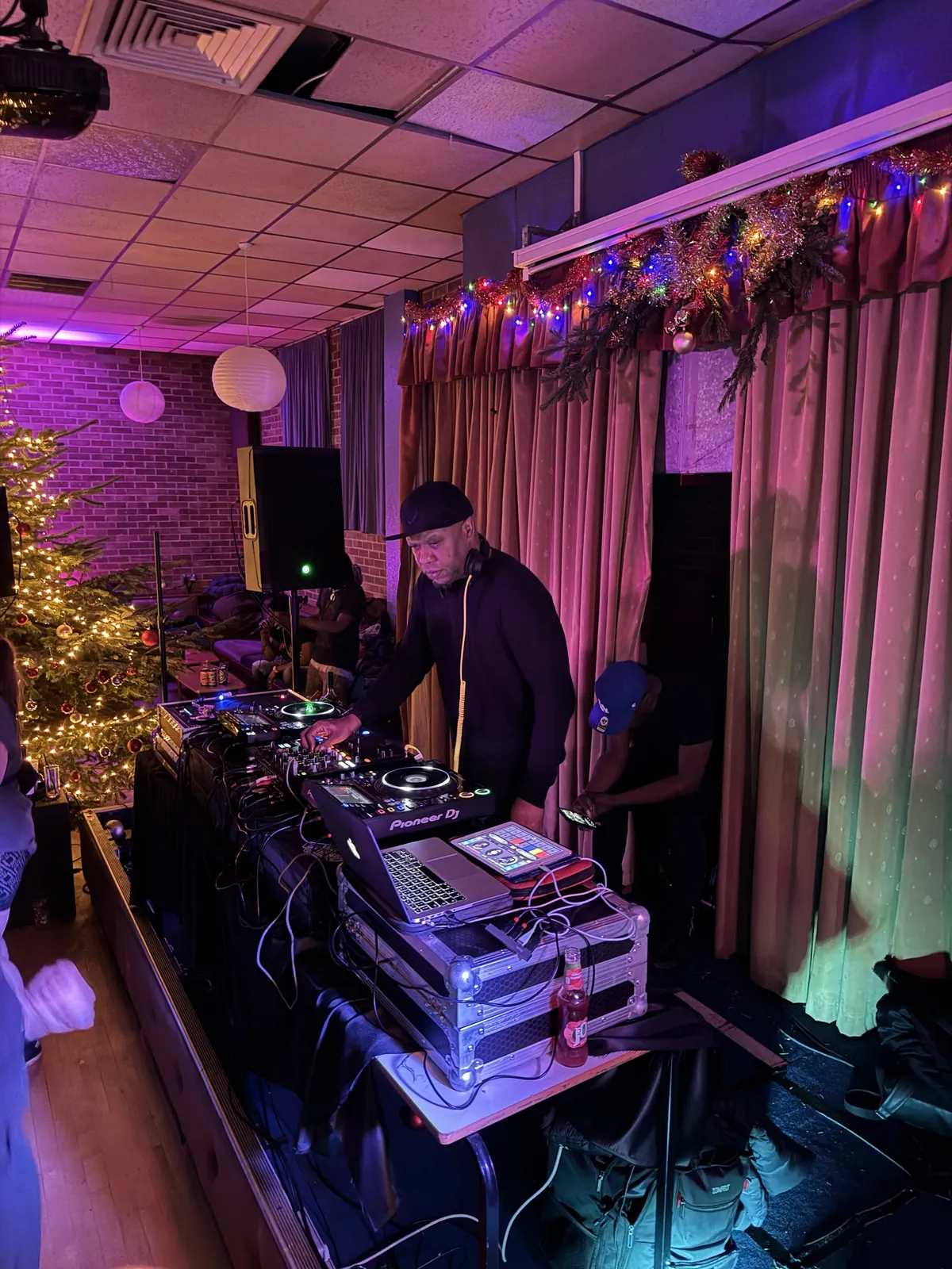 Grooverider DJing on the Upgraded Sound System decks at a Christmas party